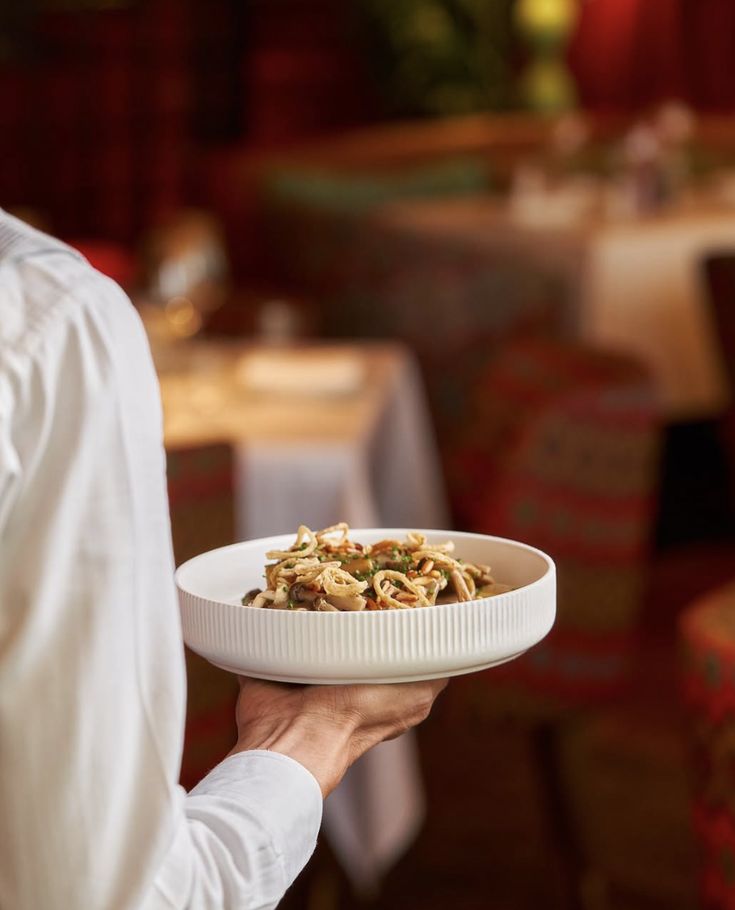waiter holding dish